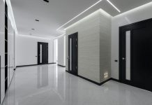 Choosing the Right Waterproof LED Strip Wholesale and Flexible LED Strip Lights Factory for Long-Term Business Growth Modern spacious corridor with white walls and floor and black doors and ceiling decorated with LED lights