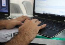 How AI-Powered Self-Healing Tests Are Revolutionizing Test Automation a man is typing on a laptop computer