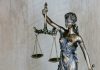5 Questions to Ask During an Initial Consultation with a Personal Injury Lawyer woman holding sword statue during daytime