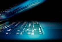 How Fidelis Security’s XDR Gives You a 360° View of Your Network closeup photo of turned-on blue and white laptop computer