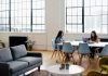 Office Upgrades That Pay Off in Performance and Retention two women sitting in front of white table