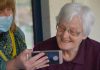 The Secret to a Successful Agency: The Right Home Care Software woman in brown button up shirt holding white smartphone