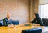 4 Financial Habits of Successful Business Owners man and woman talking inside office