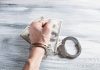 What Can Make a Criminal Charge Be Dismissed? person holding silver ring on 100 us dollar bill