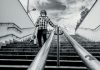 A Slip and Fall Safety Checklist for Seniors Person walking down outdoor stairs with railing