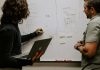 5 Common Administrative Challenges Nonprofits Face (And How to Solve Them) man wearing gray polo shirt beside dry-erase board