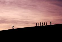 How Psychology Can Transform the Way You Lead silhouette of people on hill