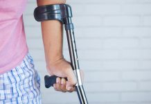 Searching for Personal Injury Attorneys Near You? a person holding a crutch and walking cane