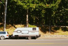 5 compelling reasons for Australians to own an off-road camper a truck towing a camper on the side of the road