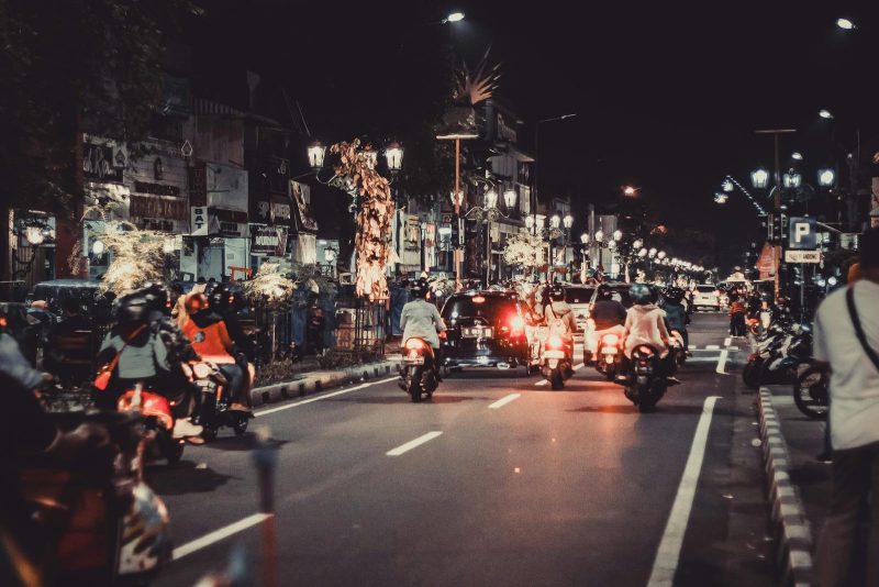 Photo by Nur Andi Ravsanjani Gusma Lively night street with cars and motorbikes. Urban life and vibrant lights capture the essence of downtown energy.