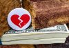 How Florida’s Retirement Asset Division Impacts Peaceful Marital Dissolutions A broken heart on top of a stack of money