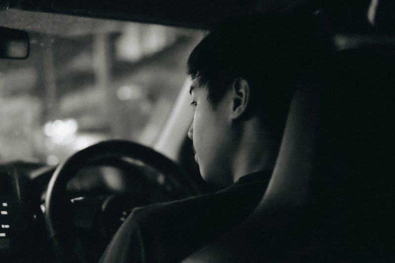 Photo by Handy Wicaksono grayscale photography of man driving car