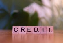 Smart Ways to Increase Your Credit Card Limit A wooden block spelling credit on a table