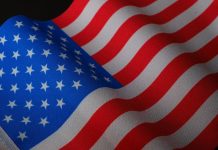 U.S. Citizenship Application Costs: What’s Included and What’s Extra Vibrant closeup of a waving American flag with stars and stripes.