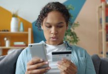 Payment Methods on the Online and Verde Casino Website Young woman holding credit card and smartphone indoors