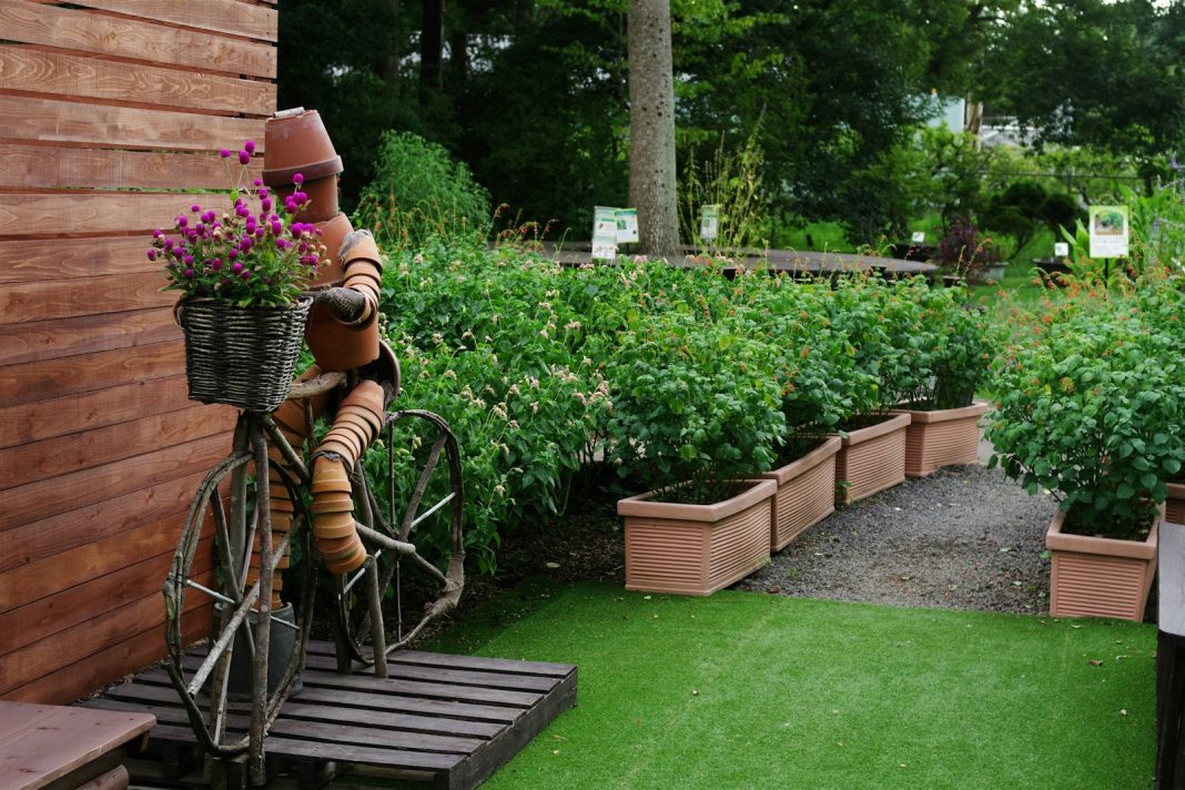 Photo by Naoki Suzuki A statue of a person riding a bicycle