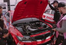 5 Top Replacement Parts for Any Vehicle Owner a group of men working on a red car