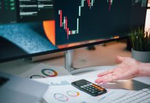 How False Complaints Can Derail a Financial Advisor’s Career a person pointing at a calculator on a desk