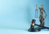 Lady justice and gavel on a blue background