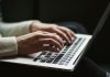 Website Design Mistakes That Could Be Costing Your Practice New Patients person using laptop