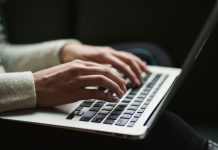 Website Design Mistakes That Could Be Costing Your Practice New Patients person using laptop