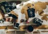 black DSLR camera near passport
