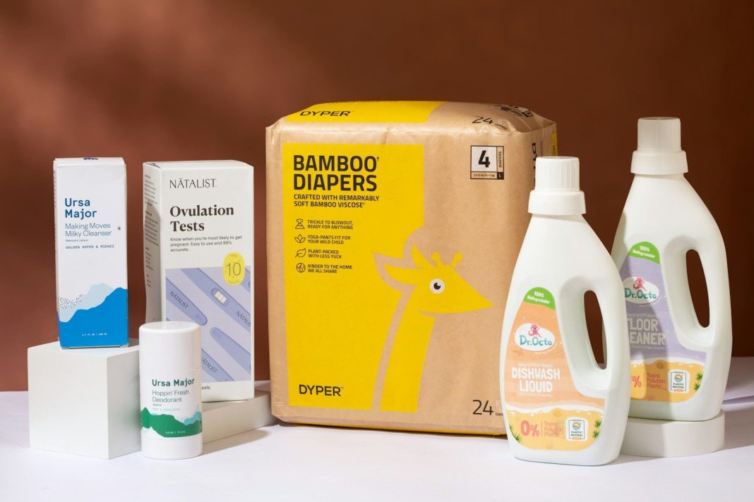 a box of diapers next to a bottle of lotion