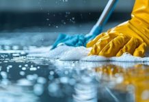 5 Ways Professional Cleaning Improves Indoor Air Quality After Renovations A person in yellow gloves and blue gloves cleaning a floor