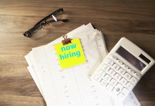 Unlocking the Hidden Executive Job Market in Southeast Asia Calculator, glasses, and papers with 'now hiring' note.