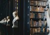 book lot on black wooden shelf