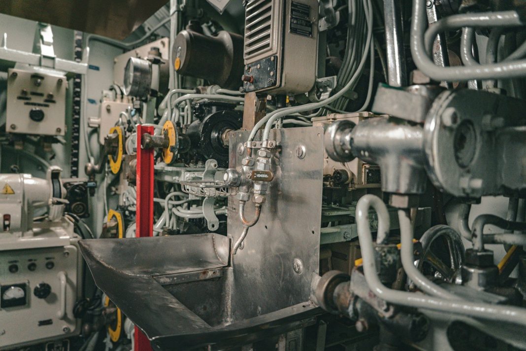 Photo by Diogo Cardoso Inside a submarine, various equipment are visible.
