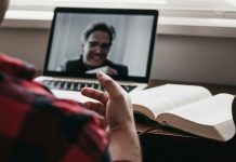 Why Smart Creators Are Turning Their Old Notes Into Video Lectures person in red and black plaid long sleeve shirt using black laptop computer