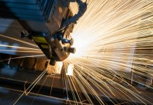 How Advanced Metal Fabrication is Transforming Architectural Engineering blue and white train on rail