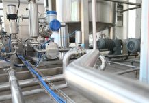 Cutting the Waste: How Reclaiming Extrusion Scrap is Changing Plastic Profile Production grey industrial equipment
