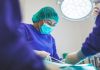 How to Choose a Surgeon for Your Upcoming Procedure woman wears green face mask