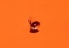 orange megaphone on orange wall