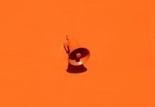 Why Generic Marketing Strategies Fail in Specialized Industries orange megaphone on orange wall