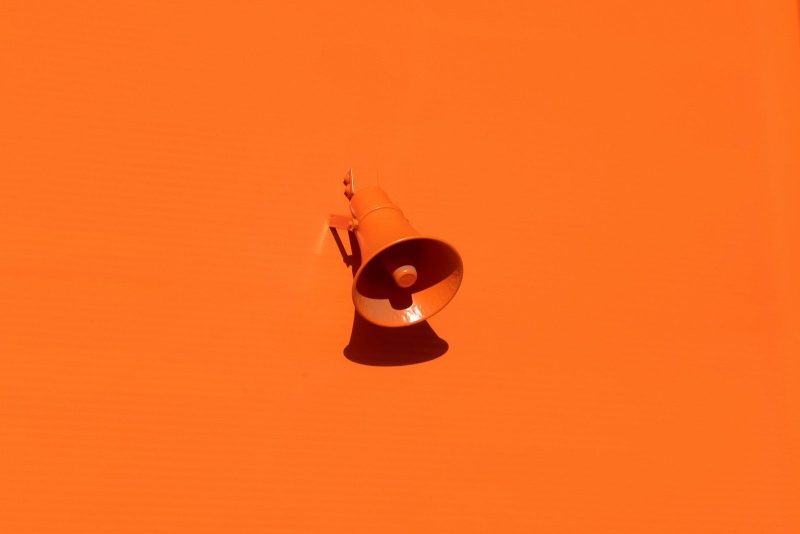 Photo by Oleg Laptev orange megaphone on orange wall