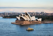 Smart Strategies for Entering the Australian Property Market in 2026 a boat is in the water near a large building