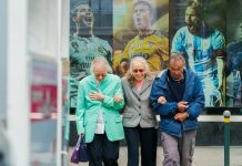 The Cost of Skipping an Elder Law Plan Until It’s Too Late two women and man walking in the street during daytime