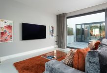 How Accessible Living Spaces Promote Better Physical and Mental Health a living room with a tv and couches