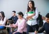 Understanding The ISB MBA Admission Process: A Complete Guide for Applicants woman carrying white and green textbook