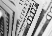 Reverse-Engineering Your SIP: Using The Mutual Fund Return Calculator Backwards To Find Your Monthly Investment closeup photo of 100 US dollar banknotes