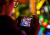 How Mobile-First Design Changed Online Entertainment man using smartphone