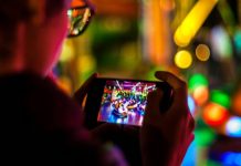 How Mobile-First Design Changed Online Entertainment man using smartphone