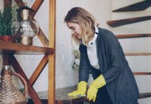 What’s it really takes to make money on small home service jobs Woman wearing yellow gloves cleaning wooden surface