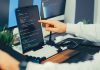 Steal Now, Decrypt Later: The Cyber Threat With a Very Long Memory A programmer working on code with a laptop and monitor setup in an office.