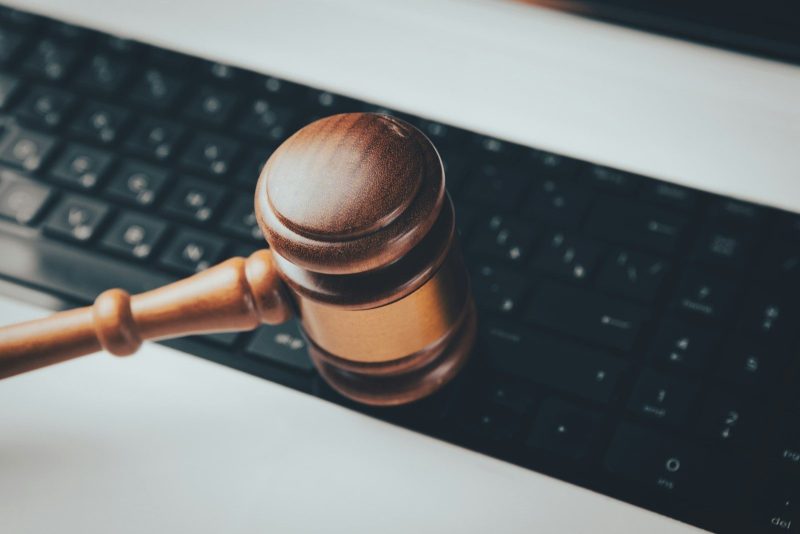 Photo by Sasun Bughdaryan a wooden gaven sitting on top of a computer keyboard