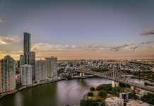 How to Plan an Unforgettable Luxury Weekend in Brisbane a bridge over a river with a city in the background