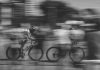 two persons riding on bicycles